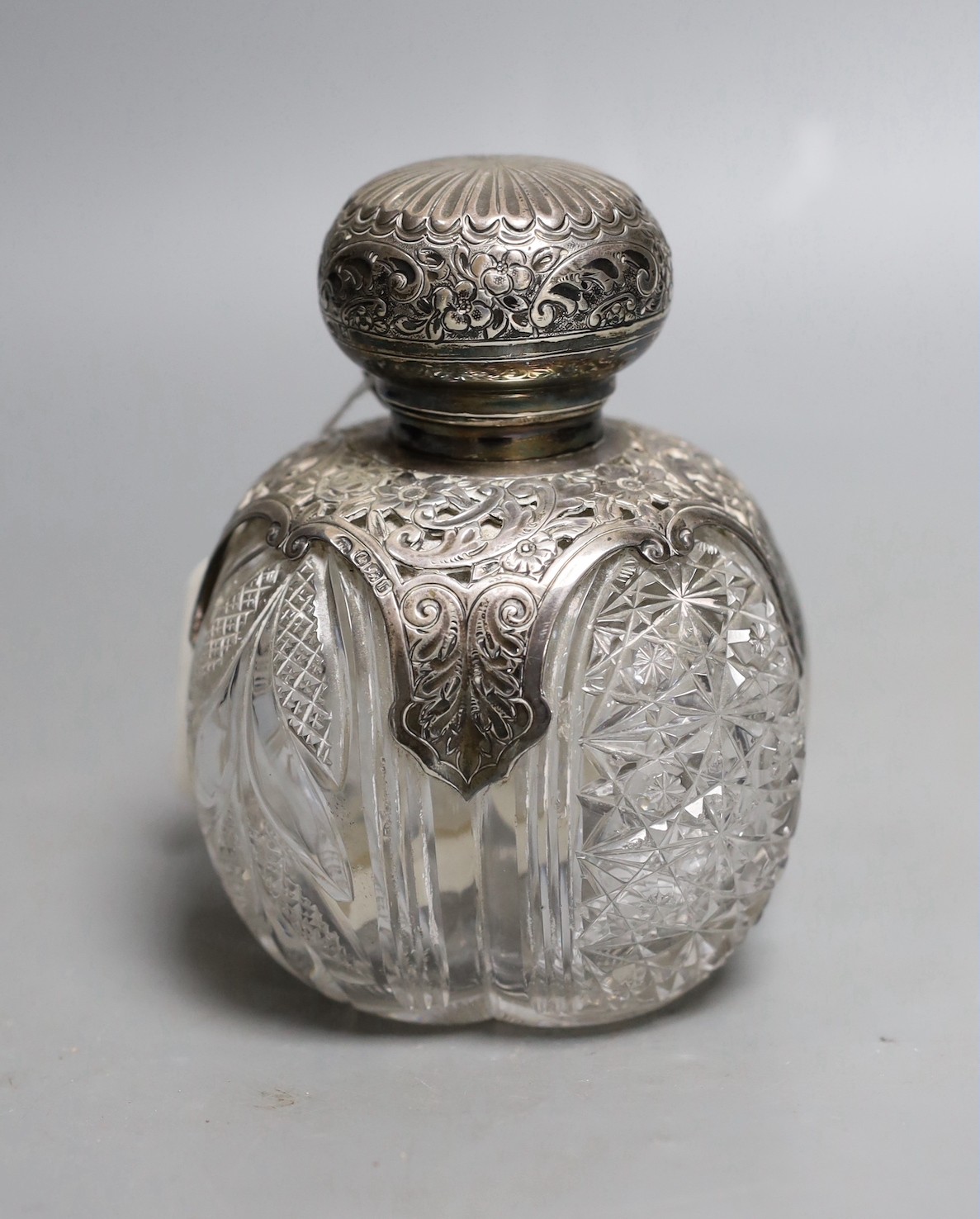 A late Victorian silver mounted cut glass scent bottle, John Round, Sheffield, 1894, height 13.1cm.